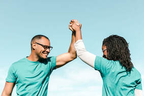 Couple Raising Hands
