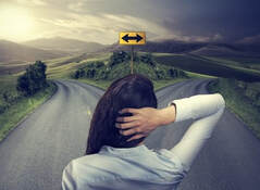 Woman looking at fork in road